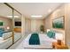 Relaxing basement bedroom with carpet, natural light, and full mirror closet at 6300 W Mansfield Ave # 61, Denver, CO 80235