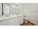 Modern bathroom with a double sink vanity, large mirror, and a separate toilet area at 24739 E 39Th Ave, Aurora, CO 80019