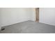 Neutral bedroom featuring gray carpeting and a connecting doorway to another room at 24739 E 39Th Ave, Aurora, CO 80019