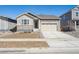 Charming single-Gathering home featuring a two-car garage and stone accents at 24739 E 39Th Ave, Aurora, CO 80019