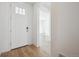 Bright foyer with white front door and views of the open floor plan beyond at 24739 E 39Th Ave, Aurora, CO 80019