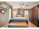 Cozy bedroom featuring stylish furnishings, ceiling fan, and ample closet space at 2731 W 32Nd Ave, Denver, CO 80211