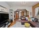 Open-concept living area with a plush sofa and hardwood floors at 2731 W 32Nd Ave, Denver, CO 80211
