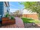 Beautiful backyard with a well-maintained deck, planters, and lawn, ideal for entertaining and enjoying nature at 11525 Eaton Ct, Westminster, CO 80020