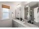 Stylish bathroom with a double vanity, modern fixtures, and ample storage space for convenience at 11525 Eaton Ct, Westminster, CO 80020