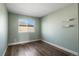 Cozy bedroom with ample natural light, neutral paint, vinyl floors, and modern ceiling fan at 11525 Eaton Ct, Westminster, CO 80020