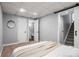 Bedroom with a walk-in bathroom and an open stairwell to the upper floors at 11525 Eaton Ct, Westminster, CO 80020