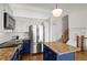 Modern kitchen with stainless steel appliances, granite countertops, and an island with blue cabinets at 11525 Eaton Ct, Westminster, CO 80020