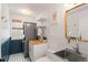Efficient laundry room features modern appliances, butcher block countertop, and stylish tile accents at 11525 Eaton Ct, Westminster, CO 80020