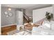 Spacious living room with hardwood floors, comfortable seating, and decorative accents adding character at 11525 Eaton Ct, Westminster, CO 80020