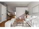 Inviting living room with natural light, hardwood floors, and a staircase visible in the background at 11525 Eaton Ct, Westminster, CO 80020