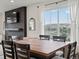 Bright dining room featuring an elegant table with a view from the adjacent living room at 9446 Quintero St, Commerce City, CO 80022