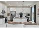 Modern kitchen featuring stainless steel appliances, granite countertops, and center island with bar stools at 9446 Quintero St, Commerce City, CO 80022
