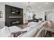 Spacious living area featuring a fireplace, comfortable seating, and open layout at 9446 Quintero St, Commerce City, CO 80022