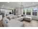 Living room and kitchen combo with an open concept layout and lots of light at 9446 Quintero St, Commerce City, CO 80022