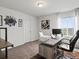 Bright home office features a modern desk, contemporary decor and plenty of natural light from the large window at 9446 Quintero St, Commerce City, CO 80022