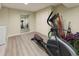 Basement area with exercise equipment and a mirror, providing a dedicated workout space at 1818 S Quebec Way # 11-8, Denver, CO 80231