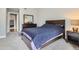 A bedroom featuring a bed, dresser, and mirror, creating a cozy and functional space at 1818 S Quebec Way # 11-8, Denver, CO 80231