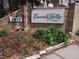 Community sign that reads Emerald Valley with greenery at 1818 S Quebec Way # 11-8, Denver, CO 80231