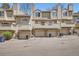 Multi-Gathering home featuring covered parking with upper level patios at 1818 S Quebec Way # 11-8, Denver, CO 80231