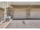 Attached garage featuring brick accents and close proximity to units at 1818 S Quebec Way # 11-8, Denver, CO 80231