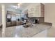 Modern kitchen featuring stainless steel appliances, granite counters, and sleek cabinets at 1818 S Quebec Way # 11-8, Denver, CO 80231