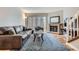Cozy living room featuring a brick fireplace, comfortable seating, and sliding glass door to the outdoors at 1818 S Quebec Way # 11-8, Denver, CO 80231