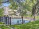 Community pool area surrounded by a black metal fence and green foliage offering a great outdoor space at 1818 S Quebec Way # 11-8, Denver, CO 80231