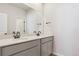 Modern bathroom with double sink vanity and quartz countertop at 14123 Deertrack Ln, Parker, CO 80134