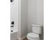 Bathroom featuring a tiled shower and modern toilet at 14123 Deertrack Ln, Parker, CO 80134