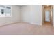 Bright, carpeted bedroom with large window offering natural light at 14123 Deertrack Ln, Parker, CO 80134