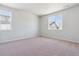 Well-lit bedroom with carpet and large windows at 14123 Deertrack Ln, Parker, CO 80134
