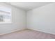 Bedroom with window and plush carpet at 14123 Deertrack Ln, Parker, CO 80134