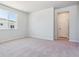Bright, carpeted bedroom with ample natural light at 14123 Deertrack Ln, Parker, CO 80134