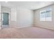Bright bedroom featuring neutral carpet, natural light, and modern, recessed lighting at 14123 Deertrack Ln, Parker, CO 80134