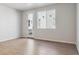 Bright living room with wood flooring, large windows, and a door to the outside at 14123 Deertrack Ln, Parker, CO 80134