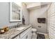 Stylish bathroom featuring a granite countertop, a vanity with white cabinets, and a shower with curtain at 16201 Lanceleaf Pl, Parker, CO 80134
