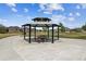 Community gazebo with seating, surrounded by green space and neighborhood views at 16201 Lanceleaf Pl, Parker, CO 80134