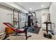 Spacious home gym featuring a weight bench, punching bag and other exercise equipment at 16201 Lanceleaf Pl, Parker, CO 80134