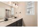 Bright bathroom featuring double sinks, modern fixtures, and neutral tones at 4104 Grand Lake St, Brighton, CO 80601