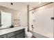 Bathroom features a single sink vanity and tub with shower at 4104 Grand Lake St, Brighton, CO 80601