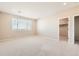 This is a bright bedroom with natural light and neutral carpet at 4104 Grand Lake St, Brighton, CO 80601