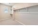 Walk-in closet with shelves and carpet at 4104 Grand Lake St, Brighton, CO 80601