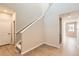 Bright entryway features hardwood floors and stairs to the upper level of the home at 4104 Grand Lake St, Brighton, CO 80601