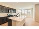 Open concept kitchen with stainless steel appliances and a large island with bar seating at 4104 Grand Lake St, Brighton, CO 80601