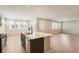 Open concept kitchen with stainless steel appliances and a large island with bar seating at 4104 Grand Lake St, Brighton, CO 80601
