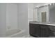 Bathroom boasts a double vanity and granite countertop at 4134 S Fraser Way # E, Aurora, CO 80014