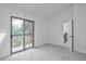 Bright bedroom with private balcony access and carpet flooring at 4134 S Fraser Way # E, Aurora, CO 80014