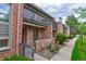 Brick building exterior with private entrance and walkway at 4134 S Fraser Way # E, Aurora, CO 80014