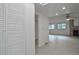 Bright hallway with white walls and vinyl flooring leading to living room at 4134 S Fraser Way # E, Aurora, CO 80014